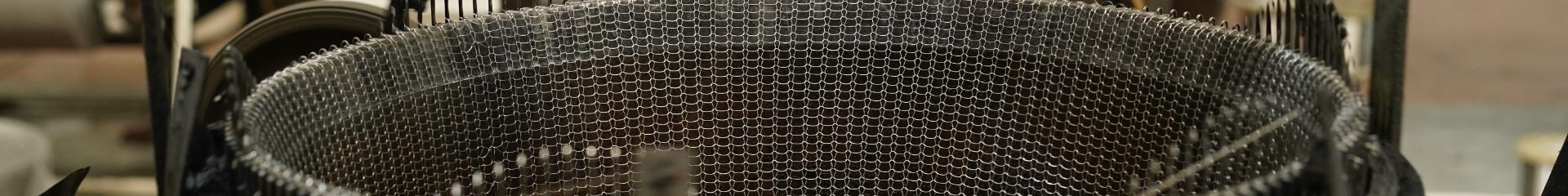 Column internal factory machine is producing metal wire mesh.